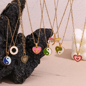 18K gold plated titanium necklace with enamel heart, yin-yang, and angel pendants
