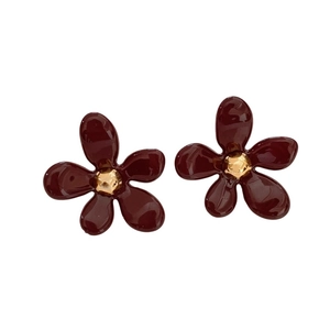 Elegant translucent reddish-brown acrylic flower stud earrings with a shiny gold stamen