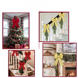 Glittery red and gold Christmas bows shown as decorative accents on trees and stairs
