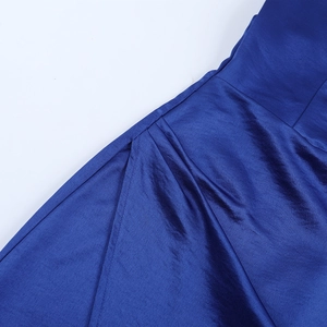 Close-up of high-quality royal blue satin fabric with elegant silk-like texture and sheen