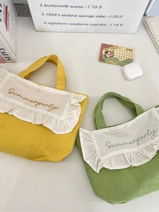 Canvas bento bag with ruffles and Summerparty embroidery in yellow and green colors