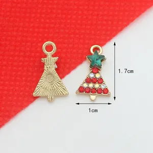 Christmas tree charm with green crystals and gold alloy base measuring 1.7cm in height