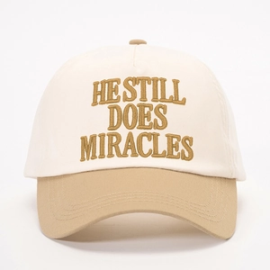 Two-tone baseball cap in beige and khaki with HESTILL DOES MIRACLES embroidery
