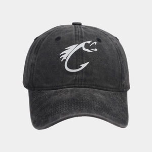 Detailed view of a washed dark grey baseball cap featuring a white fish hook logo