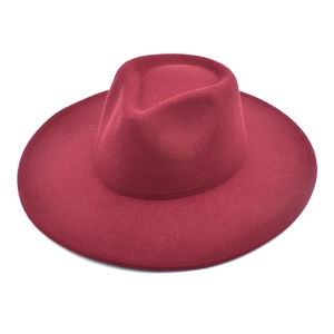 Macro shot of the burgundy wide-brimmed wool fedora hat with a teardrop crown