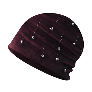 Detail of burgundy chenille knit hat with silver bead accents and pleated texture
