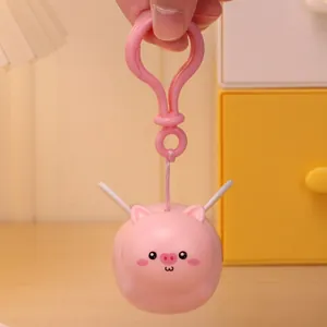 Pink cartoon flying pig keychain with wings and pink plastic carabiner for backpack decor