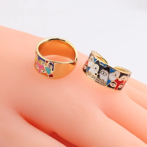 Golden husky dog enamel open ring with sparkling cubic zirconia on a hand model