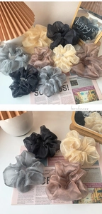 Detail view of organza scrunchies in vintage Morandi colors with a soft pleated texture