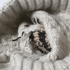 Striped knit beanie for women featuring thick light grey and dark brown jacquard patterns