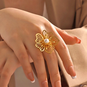 Oversized gold hollow flower ring with white pearl center for elegant women's jewelry