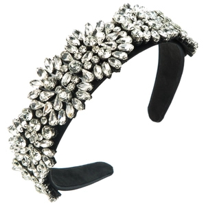 Macro detail of luxury floral headband with sparkling crystals on black velvet base