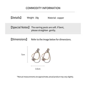 Détails de boucles d'oreilles en cuivre géométriques, hauteur 7 cm et largeur 3,5 cm