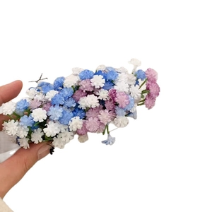 Elegant multi-color starflower hair clip with blue white and purple blossoms