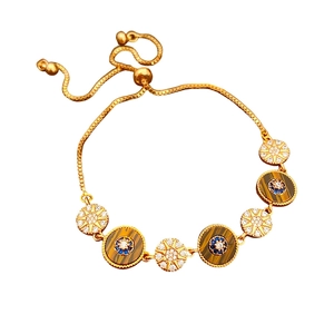 Vintage style gold adjustable bracelet with round zircon and tiger eye stone charms