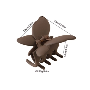 Matte brown butterfly hair claw clip made of ABS plastic with metal spring detail