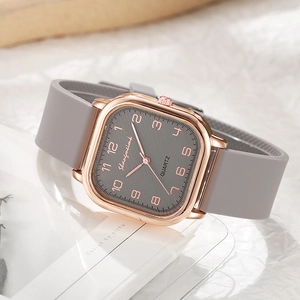 Square quartz watch with rose gold case and grey silicone strap featuring arabic numerals