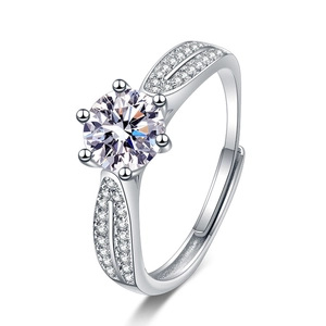 Detailed close-up of a silver six-prong wedding ring with a large zircon center stone
