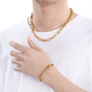 Detailed view of the 9mm gold-plated Figaro chain necklace and bracelet set for men