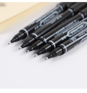 Detail shot of various black fine liner pen tips with sharp precision for art and drawing