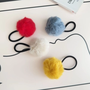 Set of 4 colorful faux fur ball hair ties in red, blue, beige and yellow plush finish