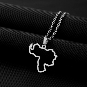 Macro shot of silver stainless steel Venezuela map pendant with a polished metallic finish