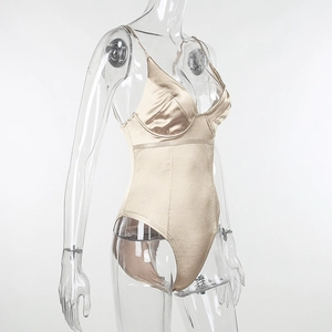 Detail of champagne satin bodysuit showing adjustable straps and glossy fabric texture