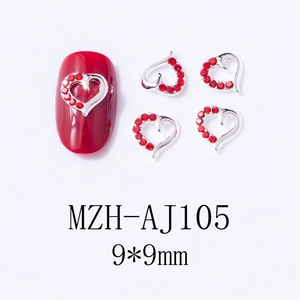 Macro view of 9x9mm red heart nail art charms with silver alloy base for manicures