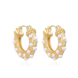Elegant gold plated textured hoop earrings with pearl accents for a sweet feminine style