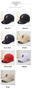 Detail view of cotton baseball caps with sandwich brims and leather golf logo patches