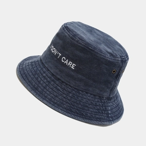 Washed vintage bucket hat with 'I DON'T CARE' embroidery and metal ventilation eyelets