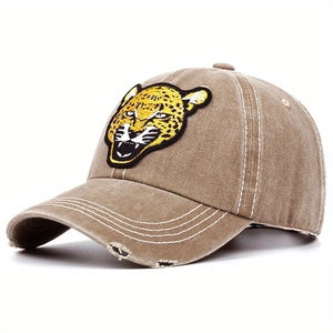 Washed cotton baseball cap featuring leopard head embroidery and distressed brim detail
