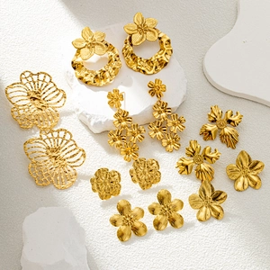 Golden flower earrings collection featuring hammered textures and delicate petal designs