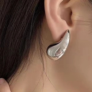 Polished silver stainless steel teardrop earrings in a minimalist drop design for women