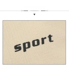 Close-up of black sport lettering printed on premium off-white breathable canvas fabric