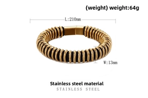 Macro shot of gold-plated spiral texture and stainless steel clasp on a men's bracelet