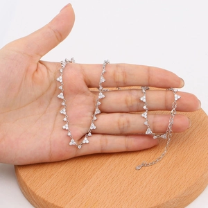 Detailed close-up of S925 sterling silver necklace with triangular zircon pendants