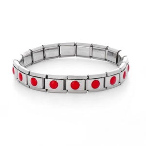 Macro view of stainless steel modular bracelet links with red circular stone accents