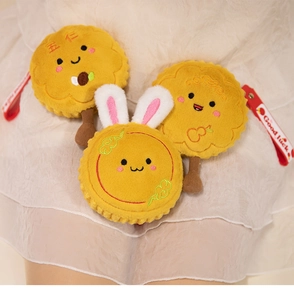 Detailed view of plush mooncake charms with cute rabbit ears and red lanyards