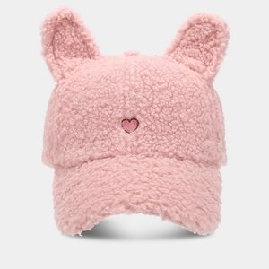 Close-up of pink plush baseball cap featuring cute fluffy ears and heart embroidery