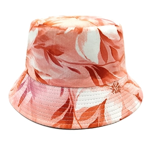 Detail of vibrant tropical leaf pattern and reinforced stitching on a reversible bucket hat