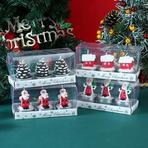 Three-piece Christmas candle set with pinecone and Santa shapes in a clear gift box