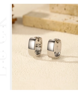 Macro shot of S925 sterling silver square hoop earrings with polished mirror finish