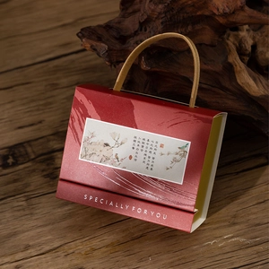 Chinese wedding candy gift box in vermilion red with golden woven handles and text