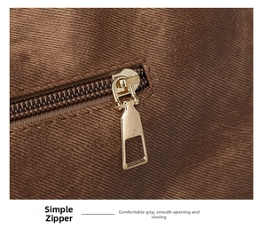 Detail of golden metal zipper on brown woven tote bag with smooth closure mechanism