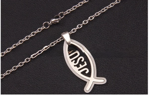 Detailed macro view of silver stainless steel Ichthys fish pendant with Jesus engraving