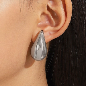 Polished silver teardrop earrings with a mirror finish for a minimalist style