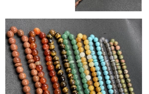 Detailed view of various natural stone beads like tiger eye, agate and rose quartz