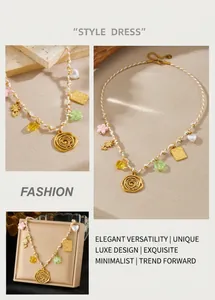 Detail of woven rope necklace featuring gold rose, heart pendants, and colorful beads
