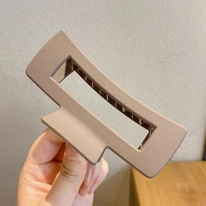 Mocha large rectangular matte hair claw clip for thick hair held in hand for size display